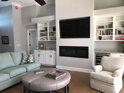 Family Room with hidden Home Theater installation
