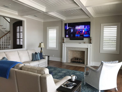 Family Room with hidden Home Theater installation